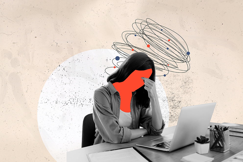 Frau sitzt grübelnd mit Laptop am Schreibtisch, wirre Linien über dem Kopf – Symbolbild für fehlenden Unternehmergeist